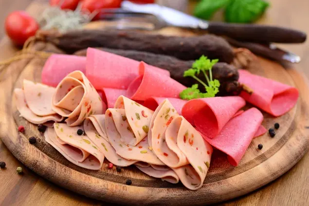 Wooden round tray with thin sliced Ham and Salami  4K wallpaper